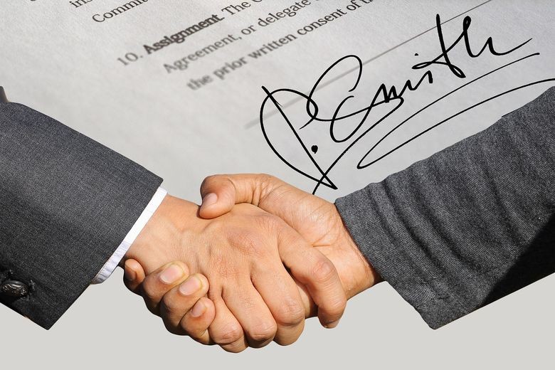 signature de document pour rachat d'entreprise